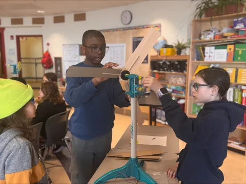 Grade 5 and 6 students at École des Trois-Soleils carefully design their model wind turbines as part of the workshop.