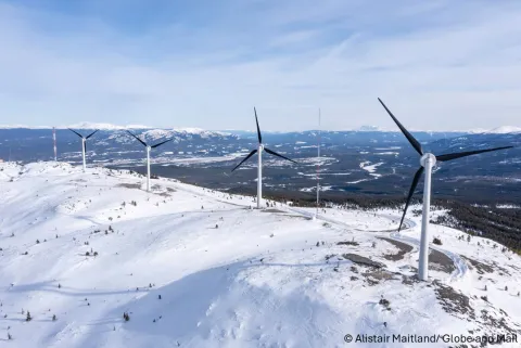 Wind turbines from the Haeckel Hill-Thay T’äw Wind Energy Project stand against the Yukon skyline in a photo captured by Alistair Maitland.
